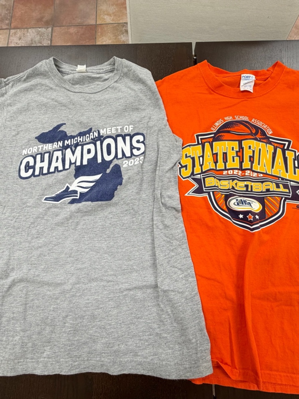 Two small 2023 basketball  tee shirts